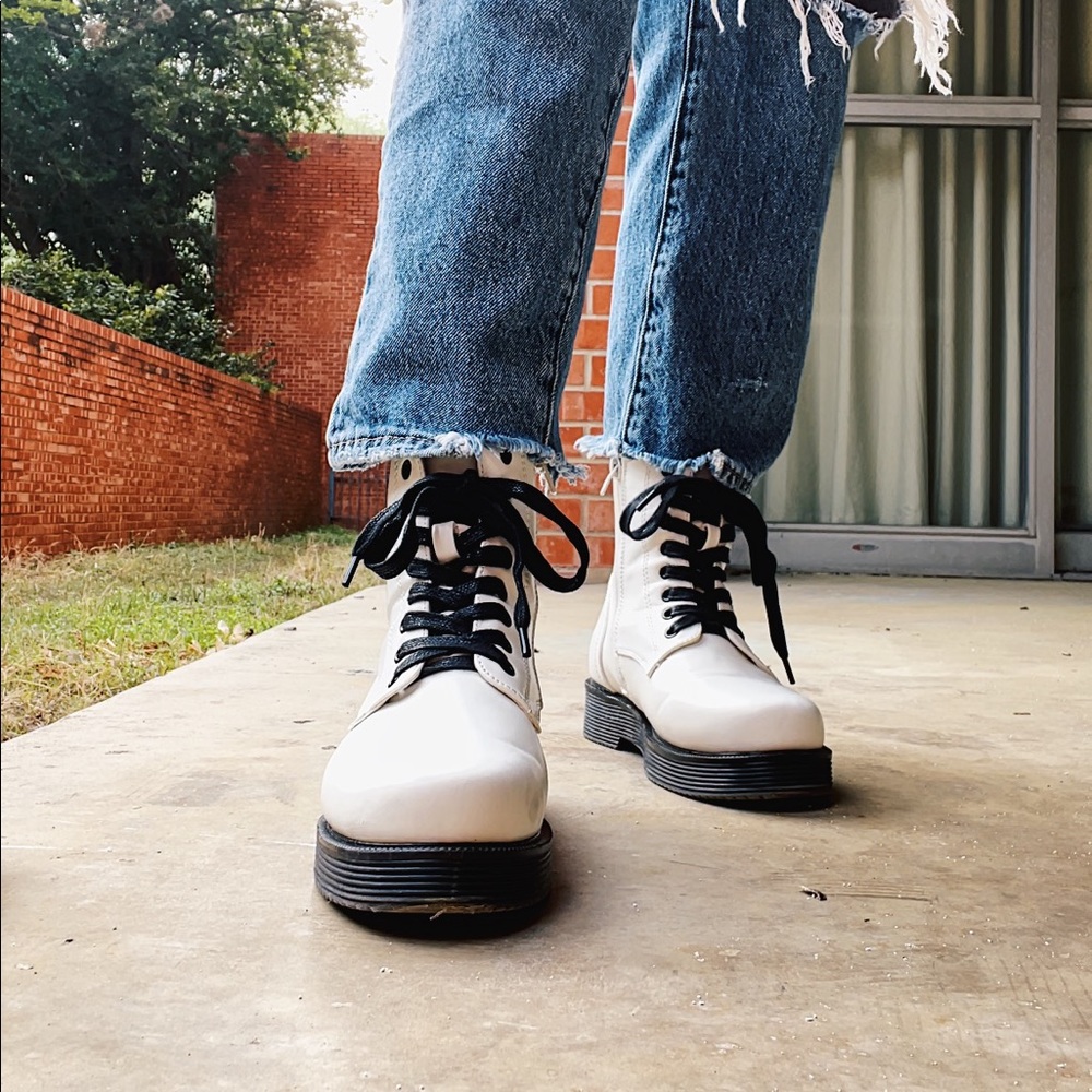 White combat boots with black laces